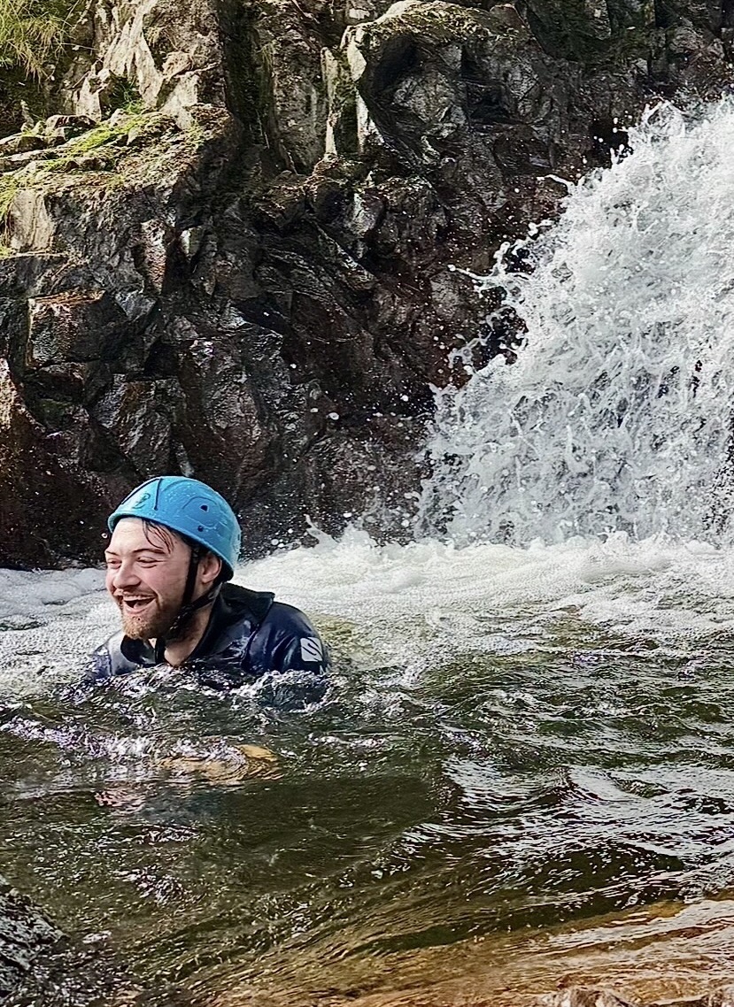 a man enjoying a mountain pool