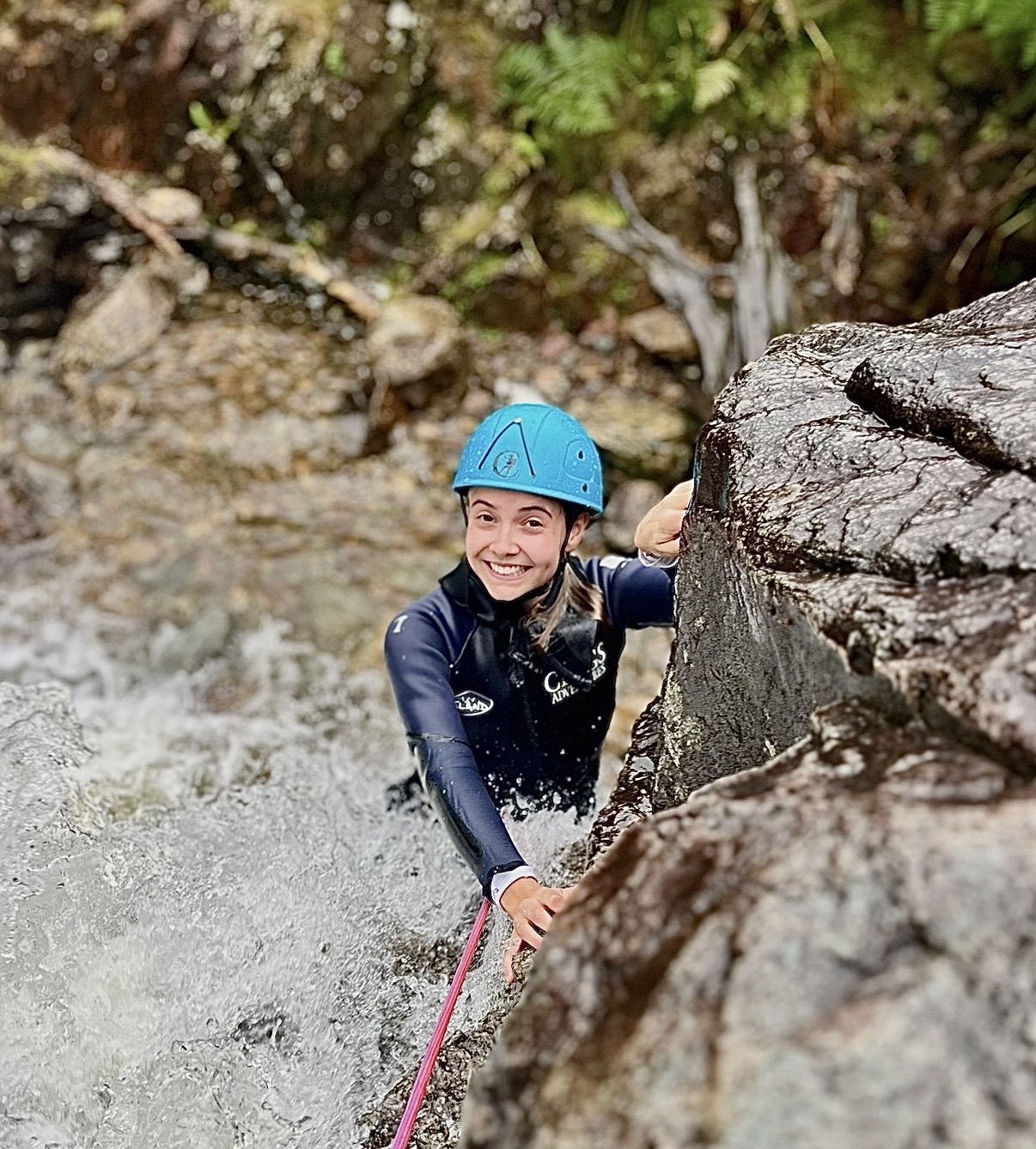 a woman ghyll scrambling