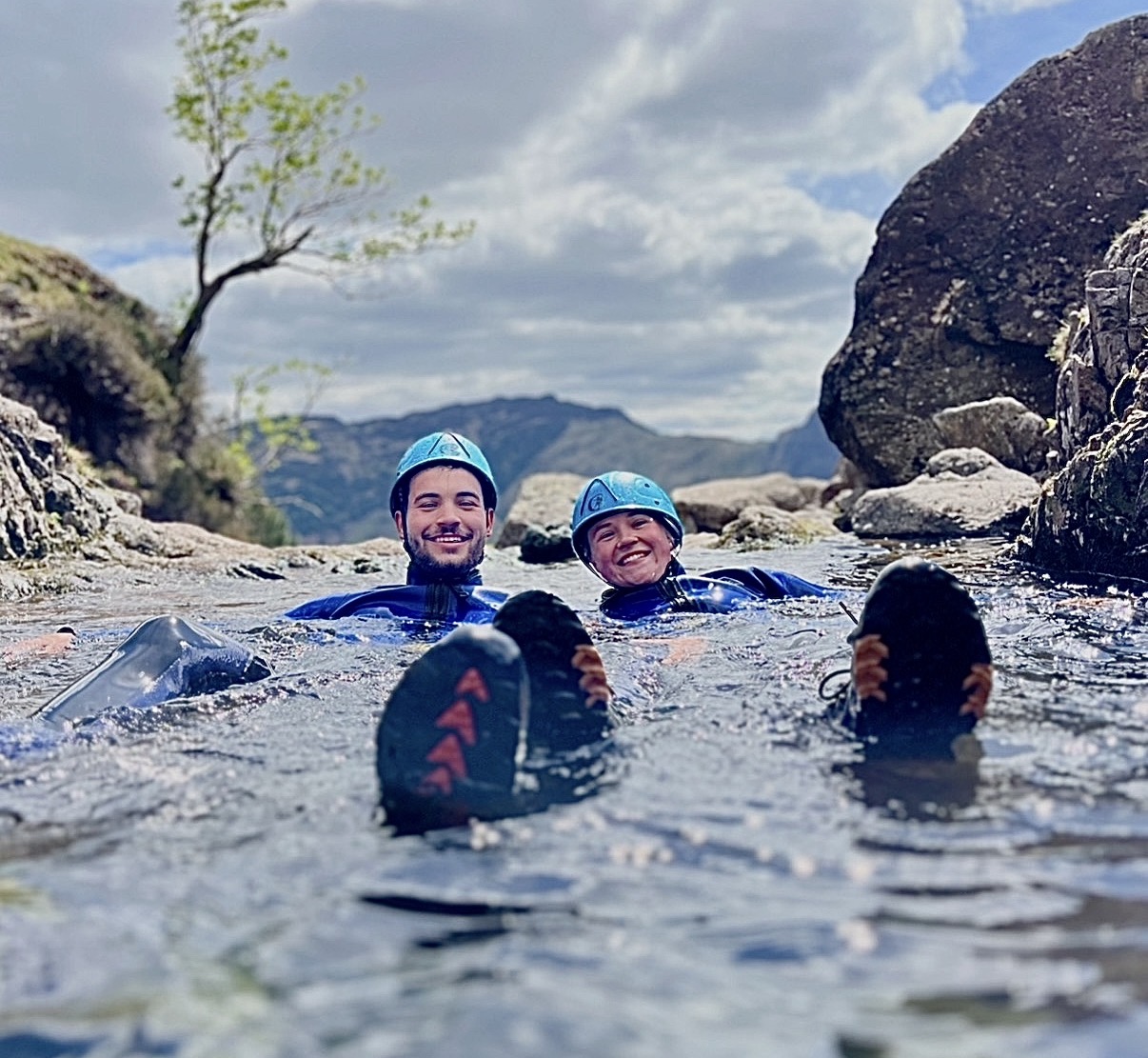a couple enjoying ghyll scrambling