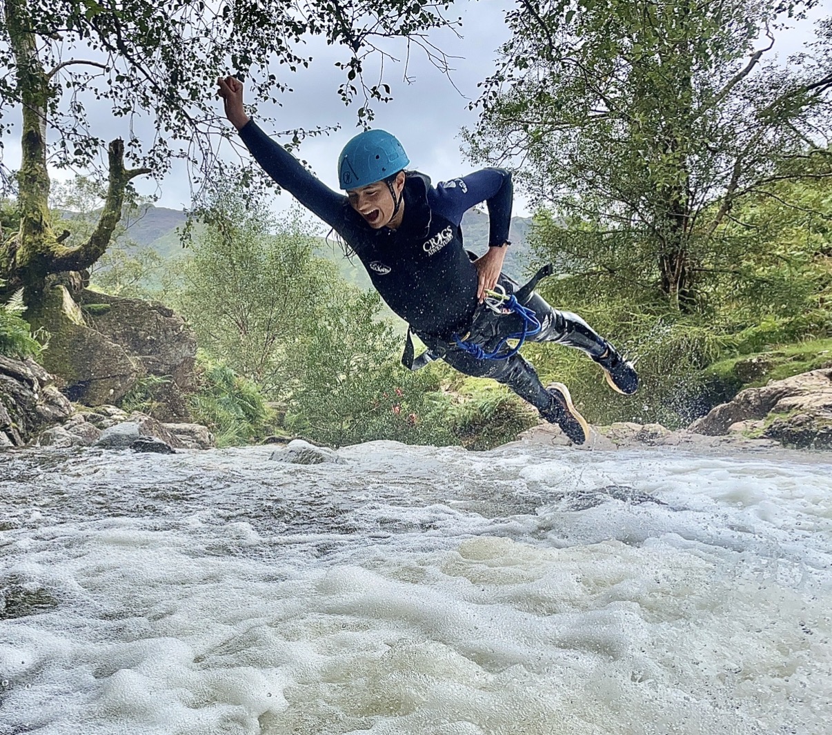 a person ghyll scrambling at stickle ghyll